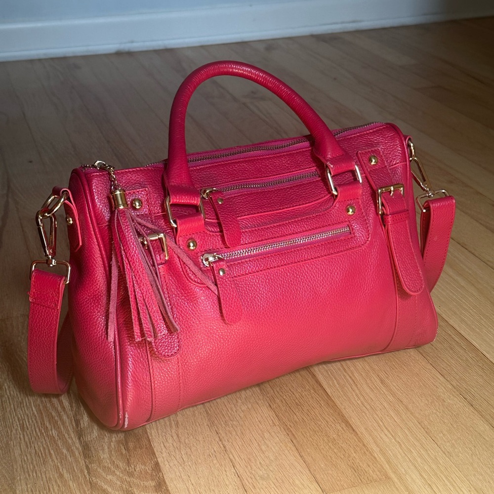 Pink Crossbody Bag with Gold Hardware and Structured Design